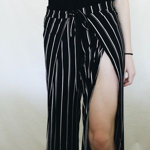 black flowy pants with white stripes